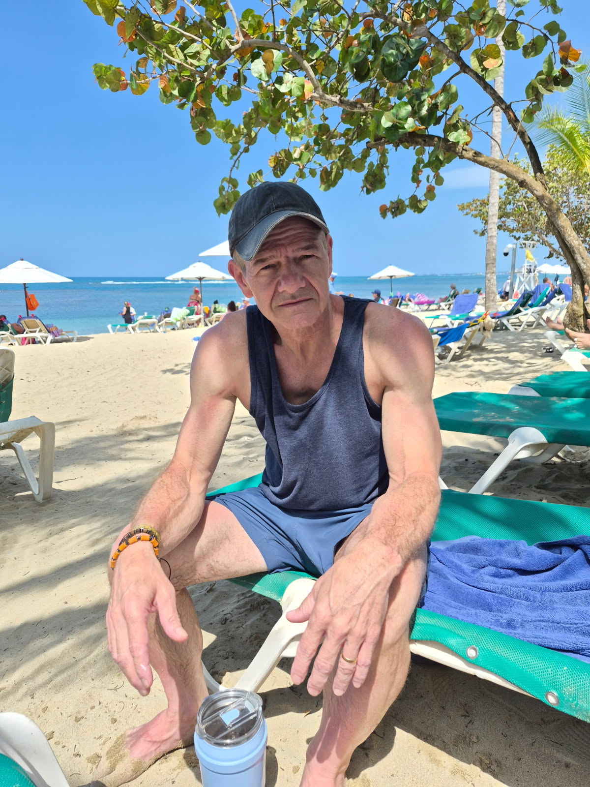 John relaxing on a sunny beach
