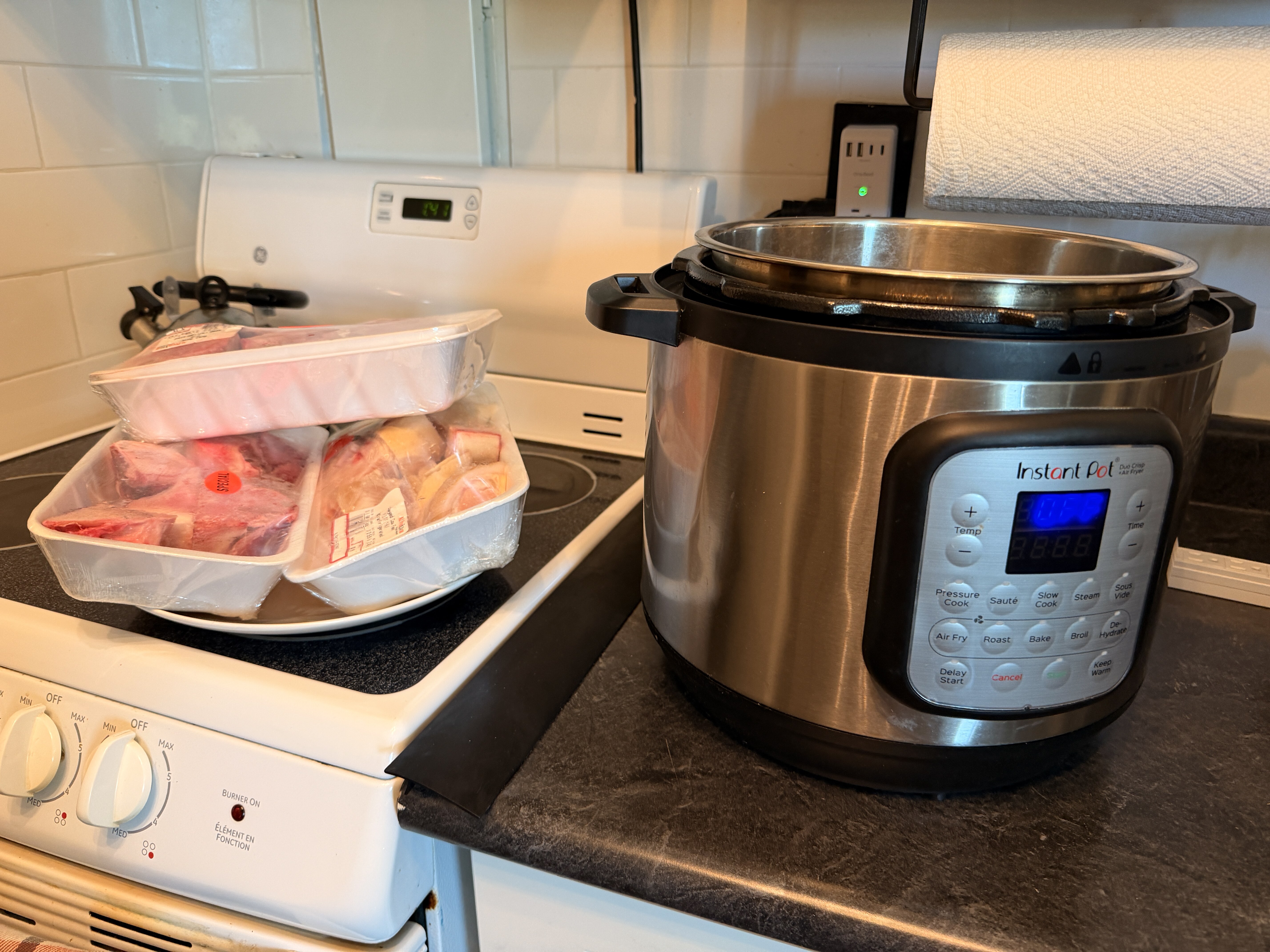 Beef bones beside John's pressure cooker before making bone broth